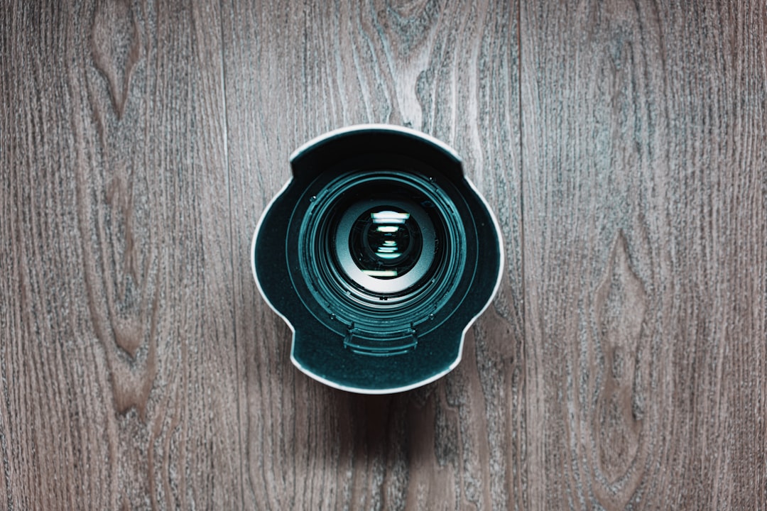 black round plastic on brown wooden table