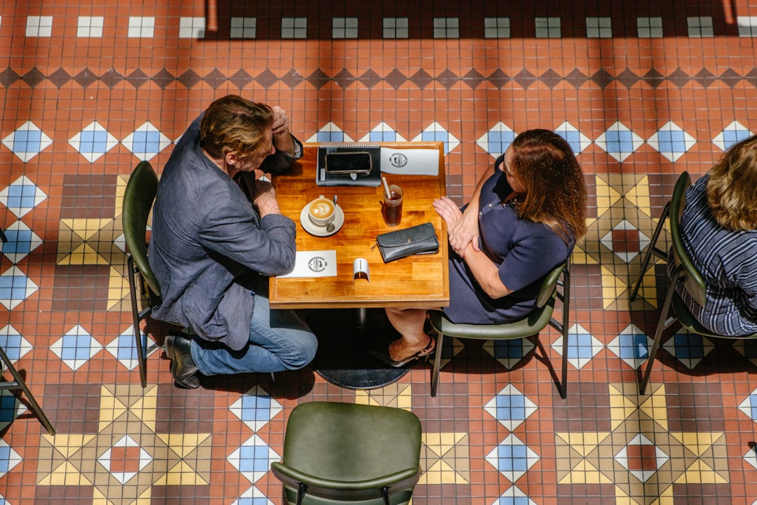 Couple sitting at a table in a cafe