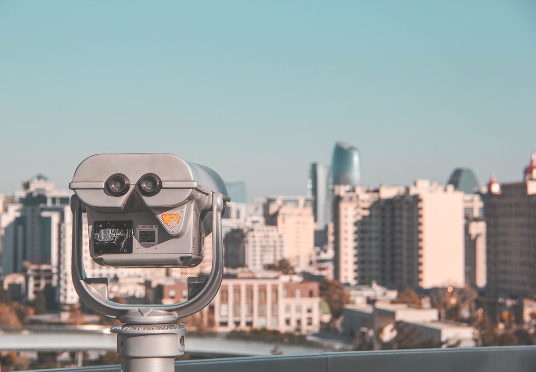 a parking meter in front of a city
