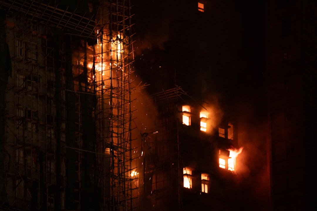 Building engulfed in flames at night